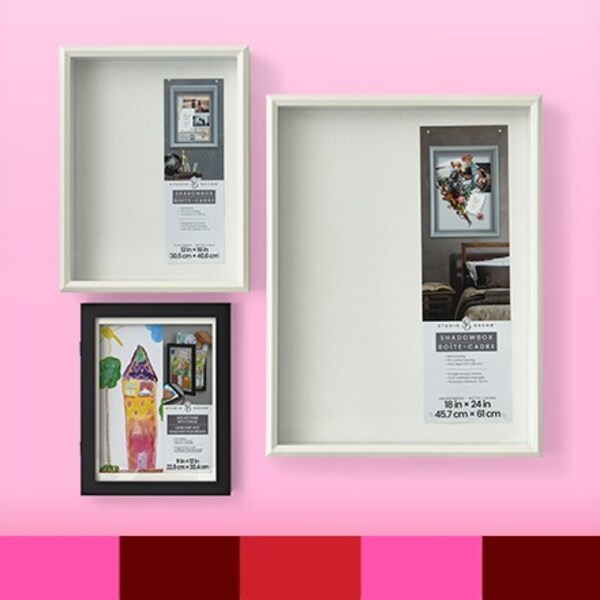 three wood frames on pink background